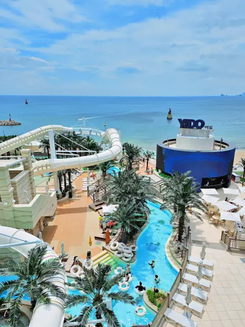 Club D Oasis Busan lazy river and water slides with Haeundae beach view