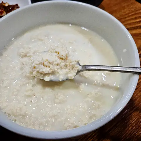 Simple and pure Chodang Sundubu served in a white bowl.
