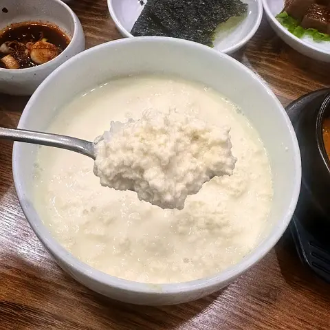 A spoonful of pure white Chodang Sundubu at Jaedong Sundubu.